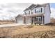 Attractive two-story home featuring brick accents, a covered porch and an attached two-car garage at 101 Ames Dr, Whiteland, IN 46184