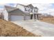 Charming home boasting a large driveway and attached garage with a combination brick and vinyl exterior at 101 Ames Dr, Whiteland, IN 46184