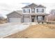 Beautiful two-story home featuring a brick facade, covered porch, and a spacious two-car garage at 101 Ames Dr, Whiteland, IN 46184