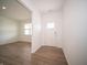 Bright foyer featuring a hardwood floor and a view into the adjacent living area at 101 Ames Dr, Whiteland, IN 46184