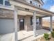 Close-up of the front porch, showcasing its brick pillars, modern lighting, and a stylish front door at 101 Ames Dr, Whiteland, IN 46184