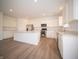 Stylish kitchen boasts stainless appliances, an island, and plentiful white cabinetry at 101 Ames Dr, Whiteland, IN 46184