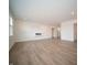Spacious living area with wood flooring, recessed lighting, and a modern electric fireplace at 101 Ames Dr, Whiteland, IN 46184