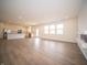 A wide open view of a living room and modern kitchen combination showing lots of natural light at 101 Ames Dr, Whiteland, IN 46184