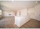Open-concept living space showcases modern kitchen island and a sleek fireplace at 101 Ames Dr, Whiteland, IN 46184