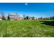 Spacious backyard with a lush green lawn, perfect for outdoor activities and relaxation at 11034 Saddlebred Dr, Indianapolis, IN 46239