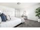 Bright bedroom features neutral walls, plush carpet, large bed, and tasteful decorations at 11034 Saddlebred Dr, Indianapolis, IN 46239