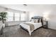 Comfortable bedroom with a beautifully tufted headboard, soft pillows, and natural light at 11034 Saddlebred Dr, Indianapolis, IN 46239