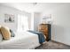 Bedroom featuring a sunny window, plush carpet, and a traditional wooden dresser at 11034 Saddlebred Dr, Indianapolis, IN 46239