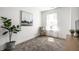 Cozy bedroom with soft carpet, chair, and view from a window at 11034 Saddlebred Dr, Indianapolis, IN 46239