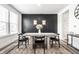 Elegant dining room with a modern table set against a decorative accent wall at 11034 Saddlebred Dr, Indianapolis, IN 46239