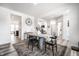 Bright dining room with a decorative rug, a large table set, and view to other rooms at 11034 Saddlebred Dr, Indianapolis, IN 46239