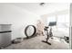Versatile space with plush carpet, exercise equipment, and plenty of natural light at 11034 Saddlebred Dr, Indianapolis, IN 46239