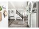 Inviting foyer with modern flooring, an elegant staircase, and stylish decor that sets a welcoming tone at 11034 Saddlebred Dr, Indianapolis, IN 46239