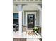 Cozy front porch featuring a welcome mat, and plants that highlight the home's charming entrance at 11034 Saddlebred Dr, Indianapolis, IN 46239