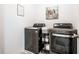 Functional laundry room with modern washer, dryer, and neutral decor at 11034 Saddlebred Dr, Indianapolis, IN 46239