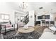 Open-concept living room offering plenty of space and an adjacent kitchen that is perfect for entertaining at 11034 Saddlebred Dr, Indianapolis, IN 46239