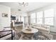 Spacious living room open to the kitchen, with natural light and modern decor, blending style and comfort at 11034 Saddlebred Dr, Indianapolis, IN 46239