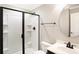 Modern bathroom featuring a walk-in shower, updated fixtures, and decorative mirror at 11710 Cold Creek Ct, Zionsville, IN 46077