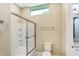 Clean bathroom with a shower and tub combination, toilet, chrome fixtures, and neutral color palette at 11710 Cold Creek Ct, Zionsville, IN 46077