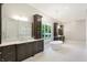 Spa-like bathroom featuring dual vanities, soaking tub, chandelier, and elegant finishes at 11710 Cold Creek Ct, Zionsville, IN 46077