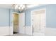 Bedroom featuring neutral paint, white trim, natural light, and doors to other rooms at 11710 Cold Creek Ct, Zionsville, IN 46077