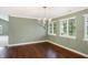 Dining room with hardwood floors, modern chandelier, and natural lighting at 11710 Cold Creek Ct, Zionsville, IN 46077