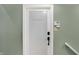 Guest quarters door with security system panel on the wall at 11710 Cold Creek Ct, Zionsville, IN 46077