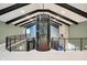 Unique glass elevator with black beams on the ceiling at 11710 Cold Creek Ct, Zionsville, IN 46077