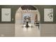 Grand foyer featuring marble flooring, a decorative table with flowers, and a chandelier at 11710 Cold Creek Ct, Zionsville, IN 46077