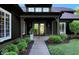 Inviting front porch with double doors, manicured landscaping, and charming curb appeal at 11710 Cold Creek Ct, Zionsville, IN 46077