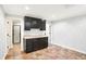 Kitchenette with dark cabinetry, tile flooring, and convenient access to other rooms at 11710 Cold Creek Ct, Zionsville, IN 46077
