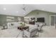 Spacious living room seamlessly connects to kitchen with a vaulted ceiling and contemporary furnishings at 11710 Cold Creek Ct, Zionsville, IN 46077