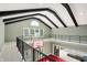 View of the upper loft featuring high ceilings, dark beams, and a basketball hoop at 11710 Cold Creek Ct, Zionsville, IN 46077