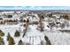 Winter aerial view showcasing a home amidst a snow-covered neighborhood, emphasizing its location and community setting at 1307 W 161St St, Westfield, IN 46074