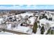 Aerial view of a beautiful neighborhood featuring mature trees and snow covered lots and homes at 1307 W 161St St, Westfield, IN 46074