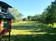 Expansive backyard featuring a well-manicured lawn and mature trees, perfect for outdoor activities at 1307 W 161St St, Westfield, IN 46074