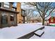 Backyard with a stone chimney, outdoor fireplace, and a view of the beautiful, snow-covered yard at 1307 W 161St St, Westfield, IN 46074
