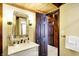 Bathroom with vanity, decorative mirror, and doorway to additional rooms at 1307 W 161St St, Westfield, IN 46074