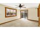 Spacious bedroom with balcony access, natural light, and ceiling fan at 1307 W 161St St, Westfield, IN 46074