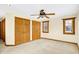 Bedroom with ceiling fan, two windows with wood trim, and closet at 1307 W 161St St, Westfield, IN 46074