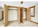 Bedroom walk in closet featuring open wooden doors and clothing rods at 1307 W 161St St, Westfield, IN 46074