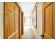 Hallway with wood trim and doors, window, and neutral colored carpet at 1307 W 161St St, Westfield, IN 46074