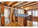 Kitchen featuring wood cabinets, an island, and an adjacent dining area at 1307 W 161St St, Westfield, IN 46074
