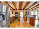 Modern kitchen with stainless steel appliances and warm wood cabinetry at 1307 W 161St St, Westfield, IN 46074