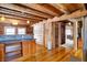 Rustic kitchen featuring wood beams, hardwood floors and an island with seating at 1307 W 161St St, Westfield, IN 46074