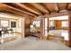 Bright living room boasts wood floors, log walls and trim, and open floor plan at 1307 W 161St St, Westfield, IN 46074