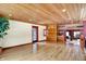 Open concept living room with natural light, light hardwood floors and wood panel accents at 1307 W 161St St, Westfield, IN 46074