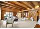 Open-concept living room with exposed beams, log walls, and carpet floors at 1307 W 161St St, Westfield, IN 46074