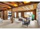 Spacious living room with exposed wood beams, neutral carpet, and log walls at 1307 W 161St St, Westfield, IN 46074
